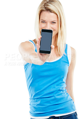 Buy stock photo Shot of a young woman holding a cellphone against a white background