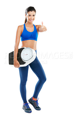 Buy stock photo Portrait of a sporty young woman holding a scale against a white background