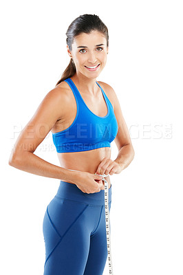 Buy stock photo Portrait of a sporty young woman measuring her waist against a white background