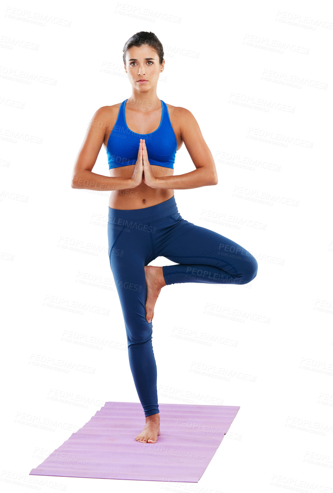 Buy stock photo Portrait of a sporty young woman practising yoga against a white background