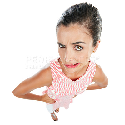 Buy stock photo Studio portrait of a young woman looking skeptical against a white background