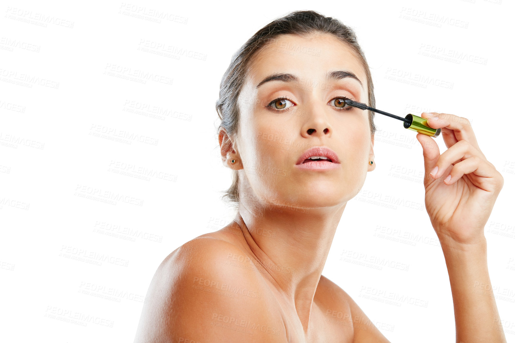 Buy stock photo Studio portrait of a beautiful young woman applying mascara against a white background