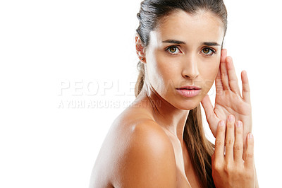 Buy stock photo Studio portrait of a beautiful young woman with a flawless complexion isolated on white