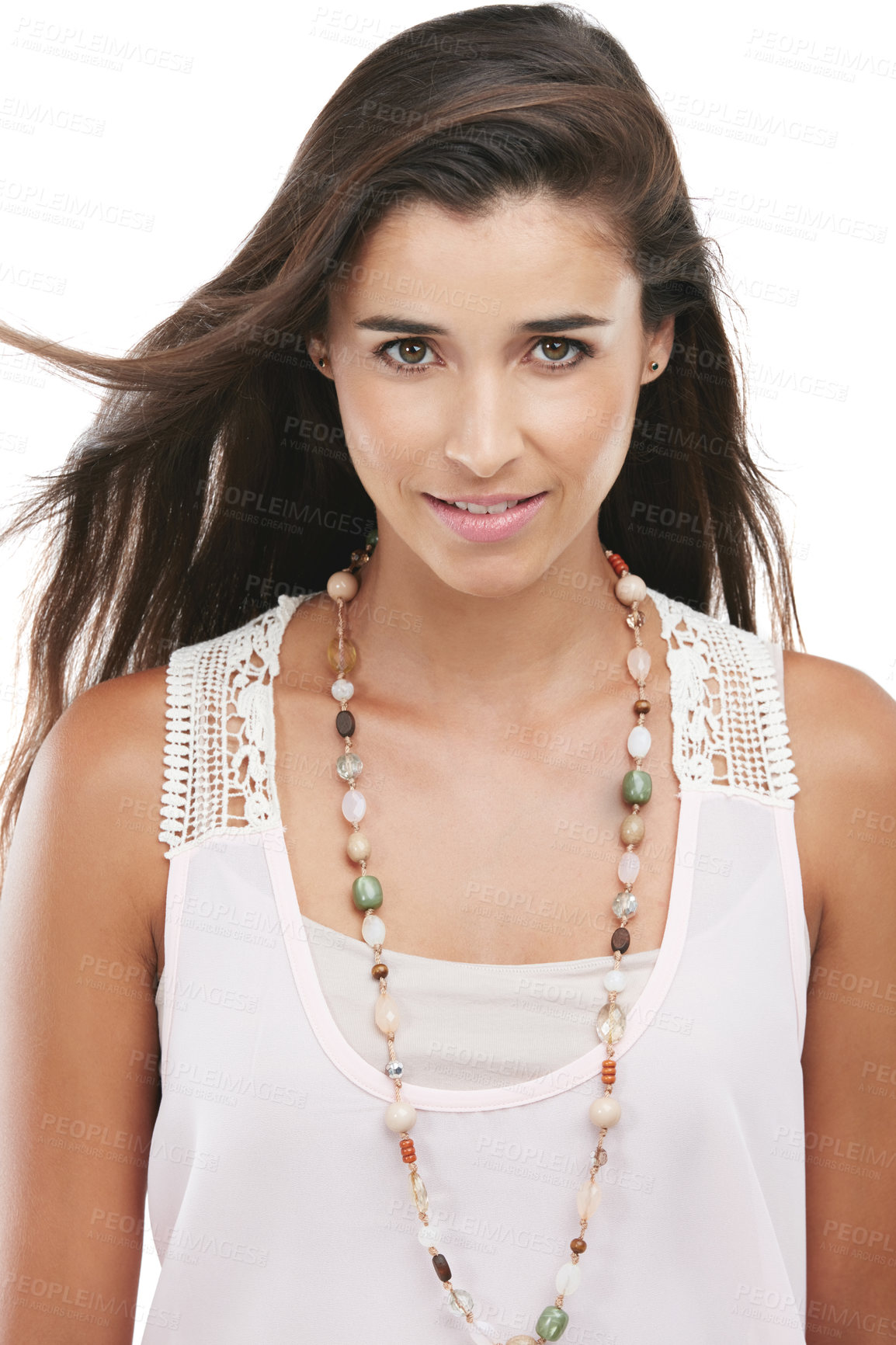 Buy stock photo Studio portrait of an attractive young woman posing against a white background