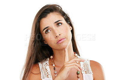 Buy stock photo Studio shot of a young woman looking thoughtful against a white background