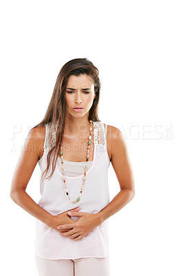 Buy stock photo Studio shot of a young woman experiencing abdominal pain against a white background