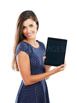 Buy stock photo Studio portrait of an attractive young woman holding up a digital tablet with a blank screen against a white background