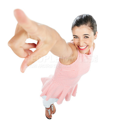 Buy stock photo High angle studio portrait of a happy young woman pointing against a white background