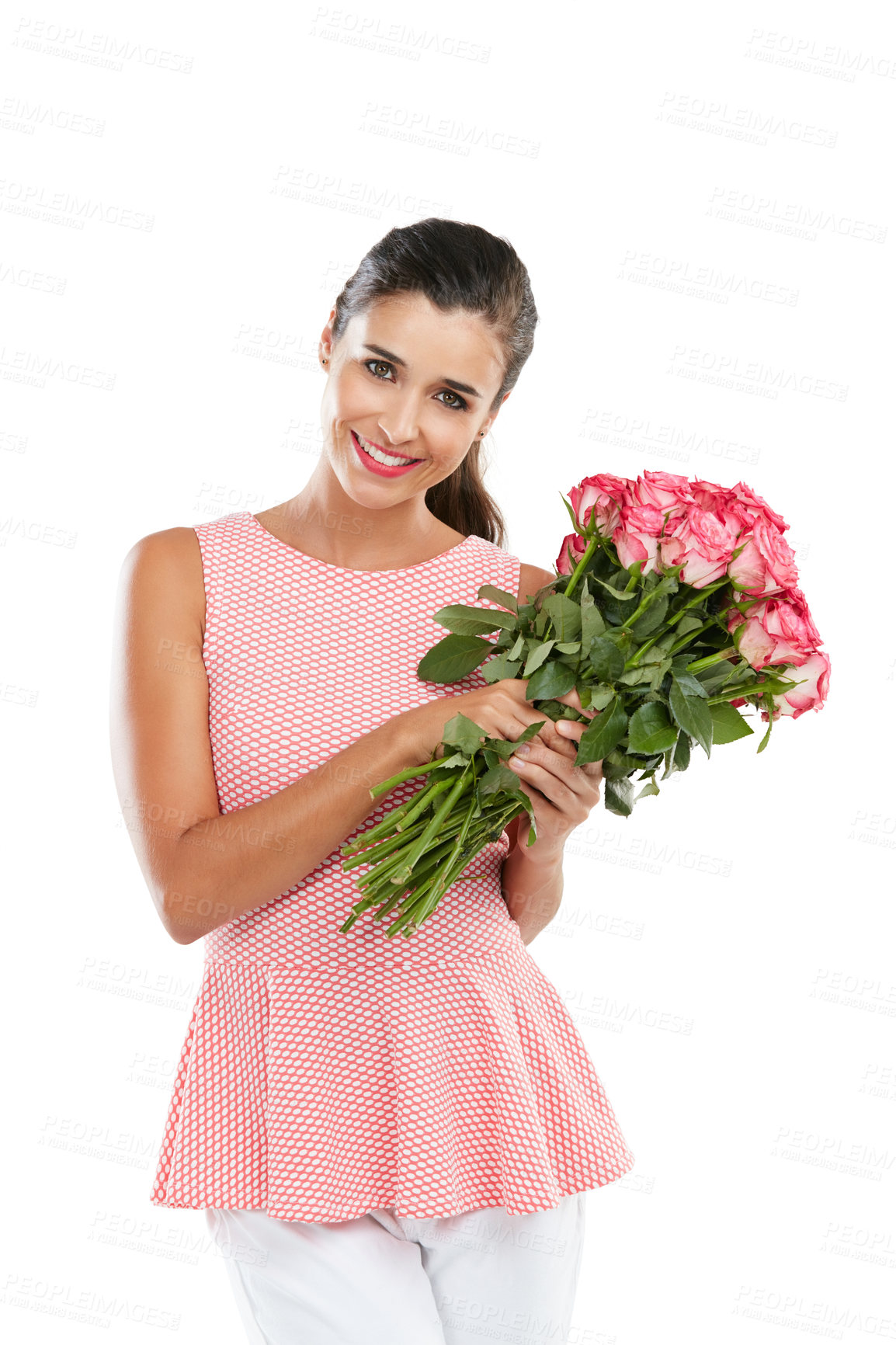 Buy stock photo Studio portrait of a happy young woman holding a bouquet of flowers against a white background