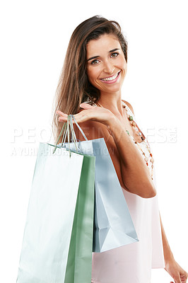 Buy stock photo Studio portrait of a happy young woman carrying shopping bags against a white background