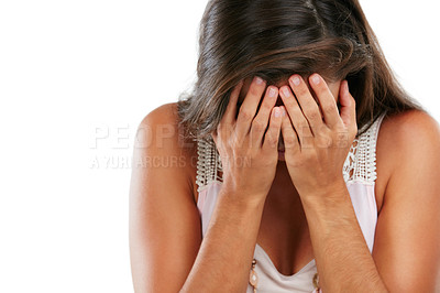 Buy stock photo Studio shot of a young woman covering her face against a white background