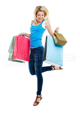 Buy stock photo Studio shot of an attractive young woman holding shopping bags