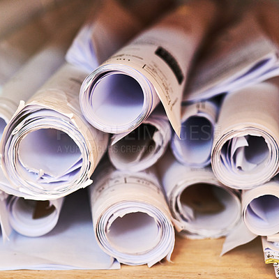 Buy stock photo Cropped shot of a pile of rolled up blueprints