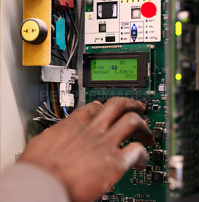 Buy stock photo Cropped shot of an unidentifiable man pressing a button on an electrical panel
