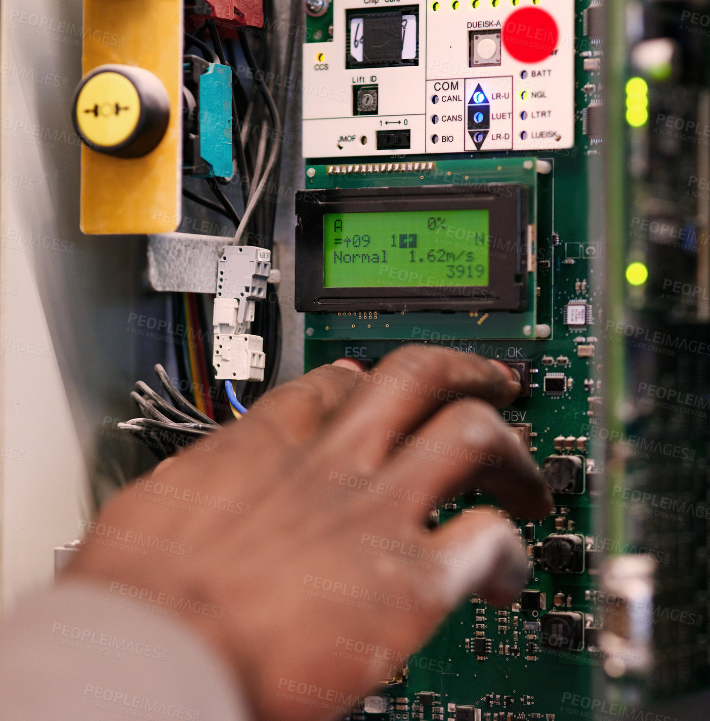 Buy stock photo Cropped shot of an unidentifiable man pressing a button on an electrical panel