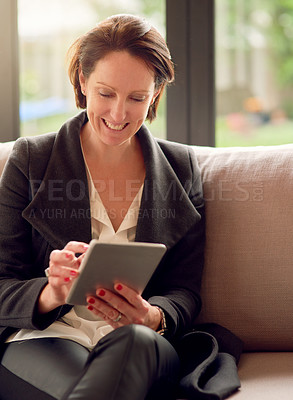 Buy stock photo Corporate woman, tablet and happy for work from home, email and communication on couch. Female person, technology and online in morning for networking, streaming and watch series in apartment