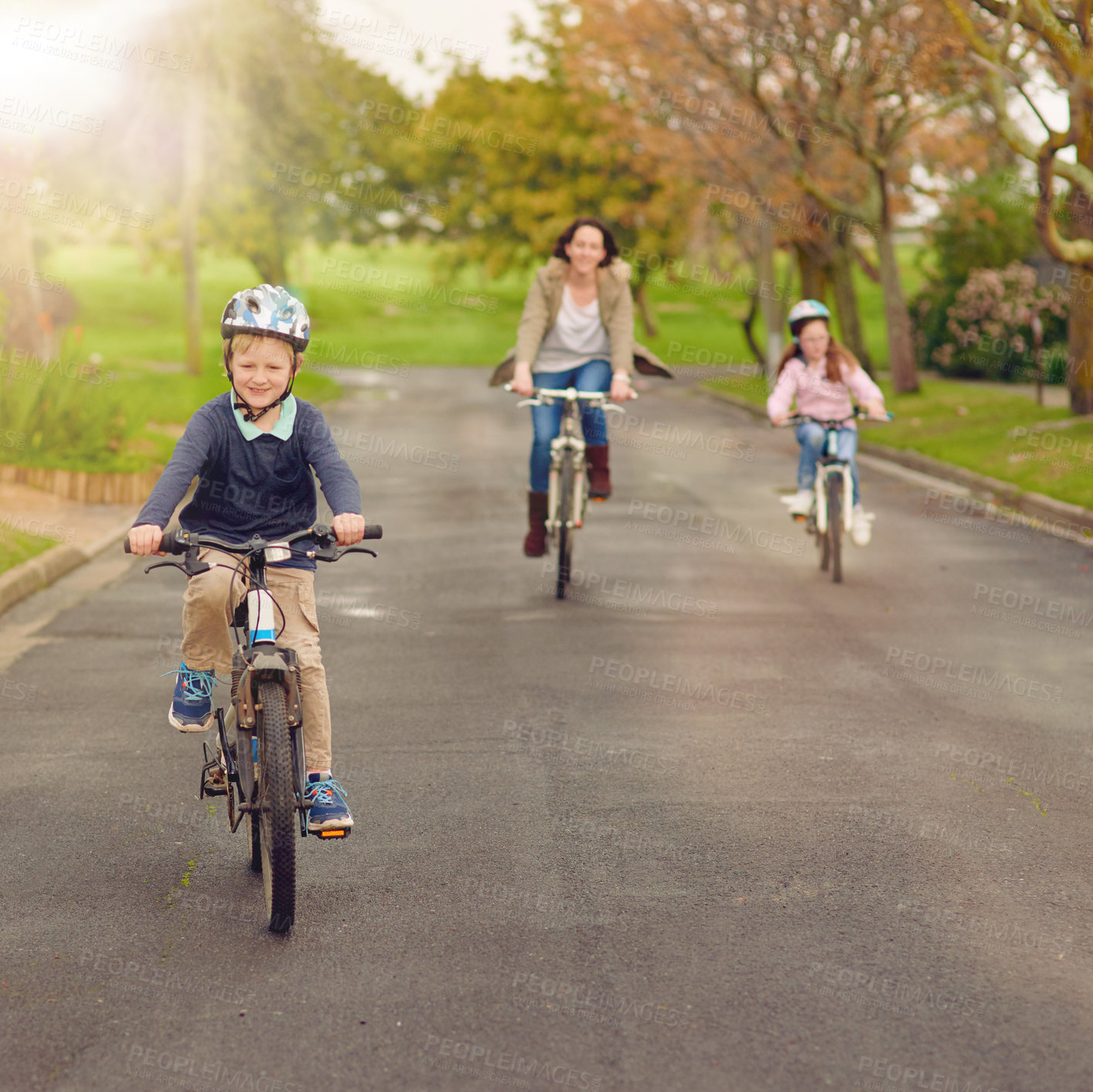 Buy stock photo Boy, family and bicycle for fun outside, road and mother with sister in nature for bonding and childhood development. Growth, helmet and safety, riding and children in neighbourhood with parent