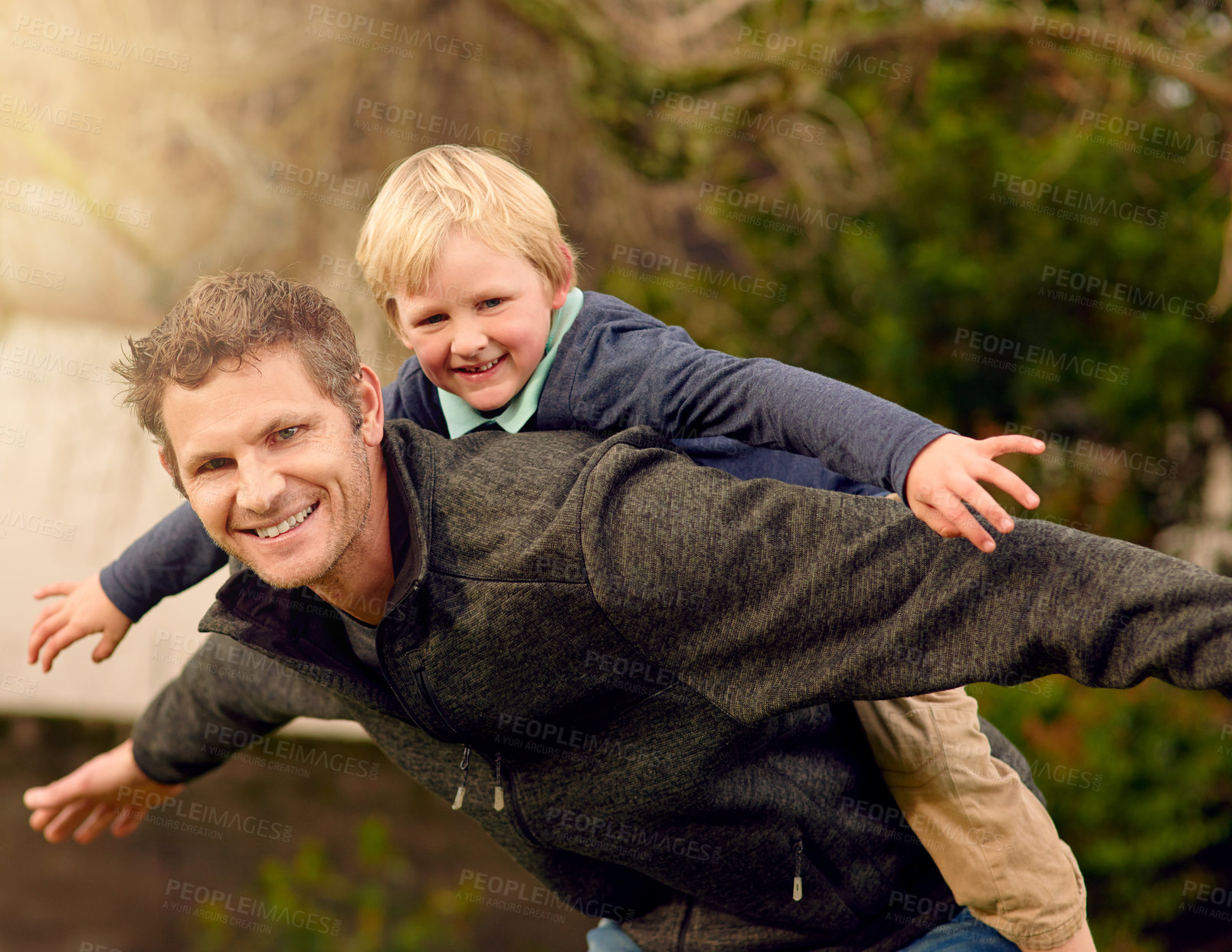Buy stock photo Father, son and airplane game outside, backyard and happy or smile with family in garden. Bonding, playing and together for love and care, childhood development and growth with parent with piggyback