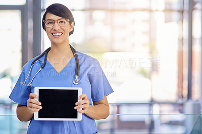 Buy stock photo Portrait of a young medical practitioner holding up a digital tablet