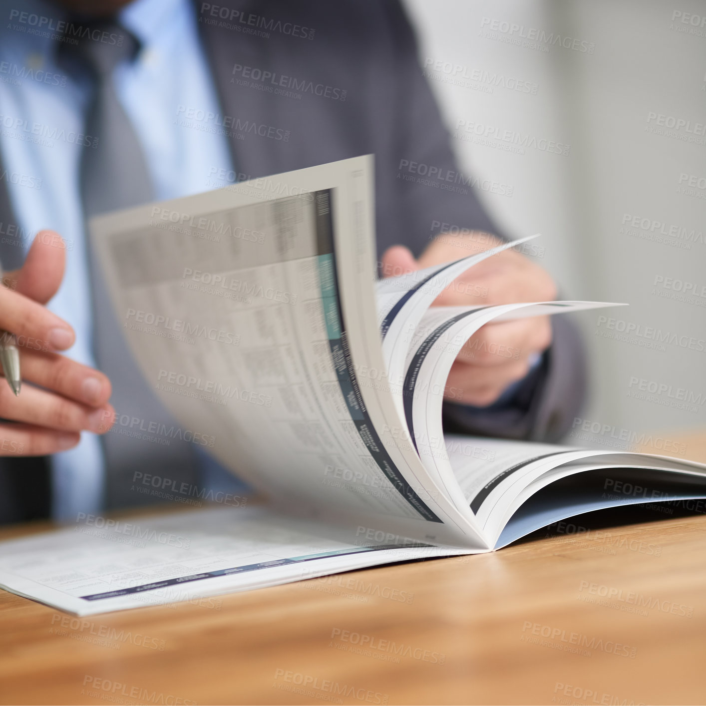 Buy stock photo Cropped shot of an unidentifiable man reading a book