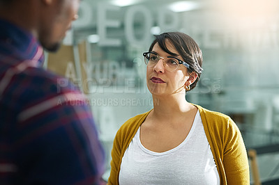 Buy stock photo Business, discussion and woman in office for meeting, advice or feedback on progress of project. Lens flare, graphic design agency and team manager for opinion, conversation or listening to coworker
