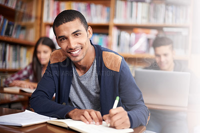 Buy stock photo Study, writing and library with portrait of man for education, research and classroom quiz. Smile, learning and notebook with male student on university campus for knowledge, scholarship and project