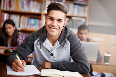 Buy stock photo Learning, writing and college with portrait of man in library for education, research and classroom quiz. Focus, study and notebook with student at university for knowledge, scholarship and project