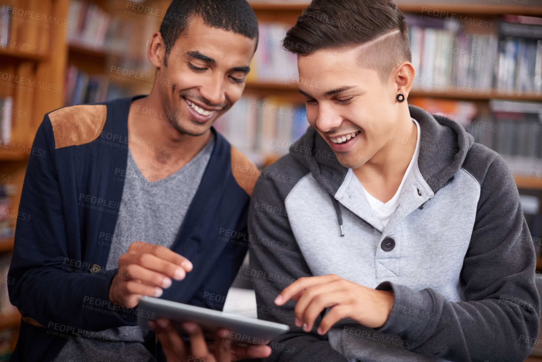 Buy stock photo Tablet, students or talking of online course in library or diversity for academic research in university. Young men, technology and collaboration for elearning and internet for education in college