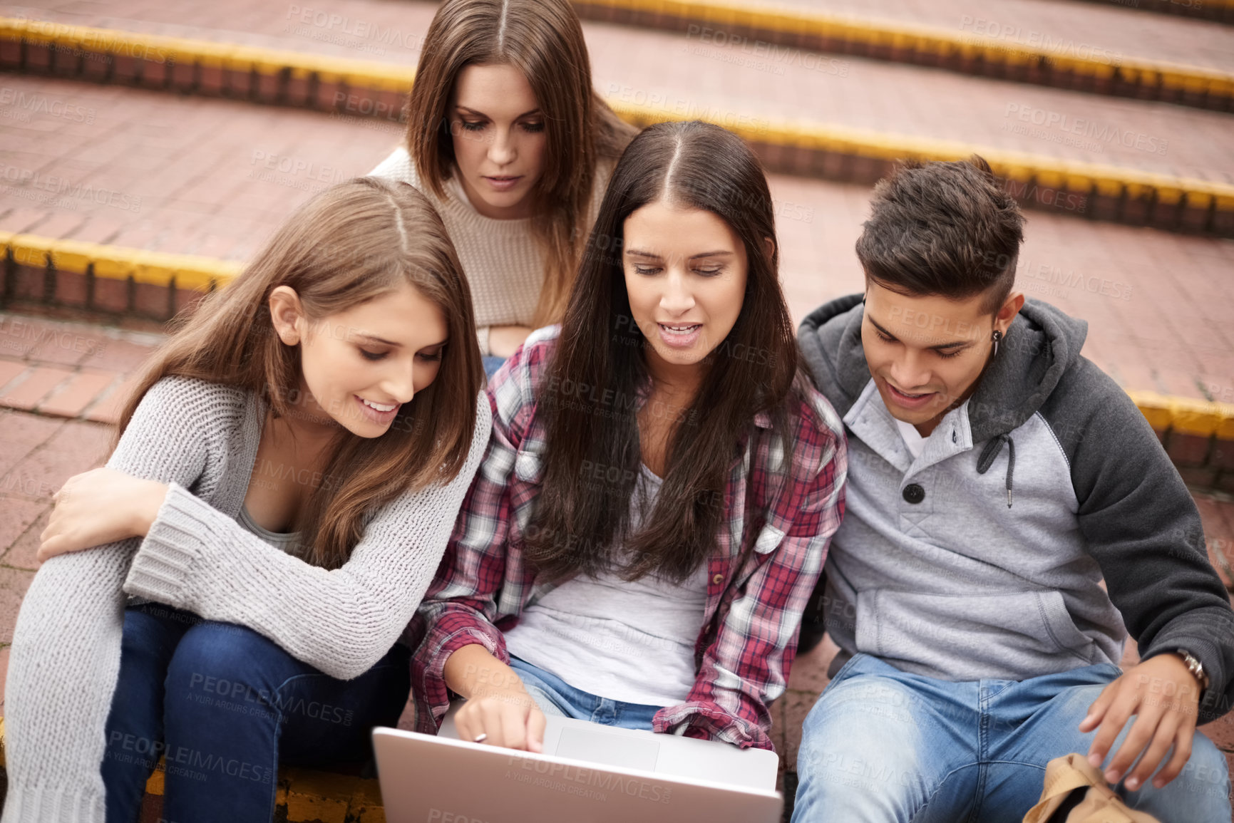 Buy stock photo University, laptop and friends on campus stairs in conversation, learning and discussion for group project. Diversity, education and men and women students on computer for school, academy and college