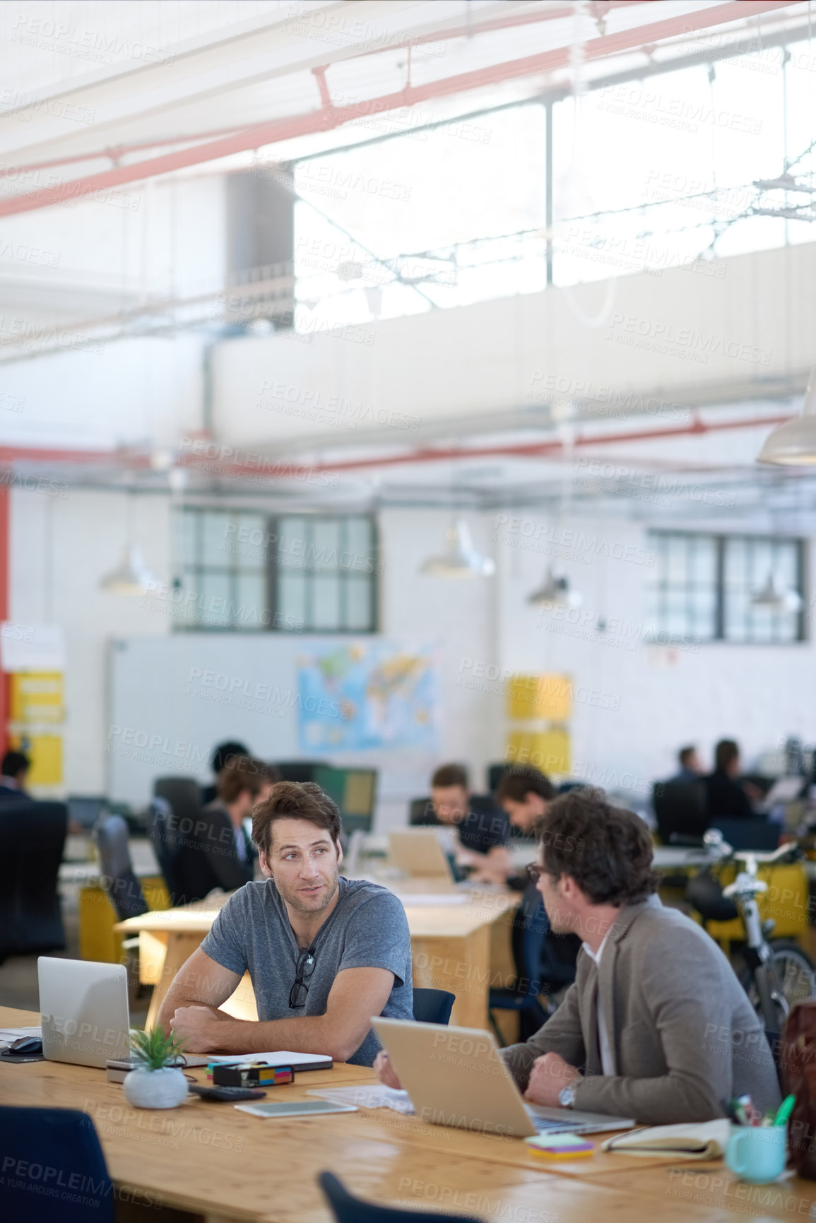 Buy stock photo Business people, discussion and laptop for collaboration on research, problem solving and teamwork. Men, partnership and together for planning in coworking office, brainstorming and conversation