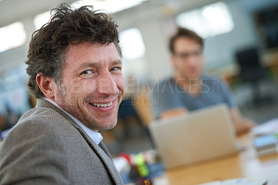 Buy stock photo Happy, portrait and creative man coworking in office with team and planning project with laptop on desk. Mature, employee and productivity in collaboration, cooperation or development of ideas