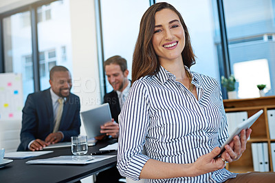 Buy stock photo Portrait, happy and business woman on tablet in office meeting for coworking, about us and leader in company. Face, agent and smile of entrepreneur on digital tech, staff and manager with work team