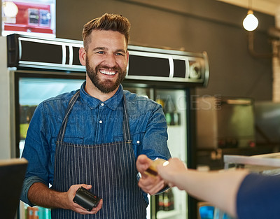 Buy stock photo Cropped shot of a waiter accepting a credit card payment from a customer