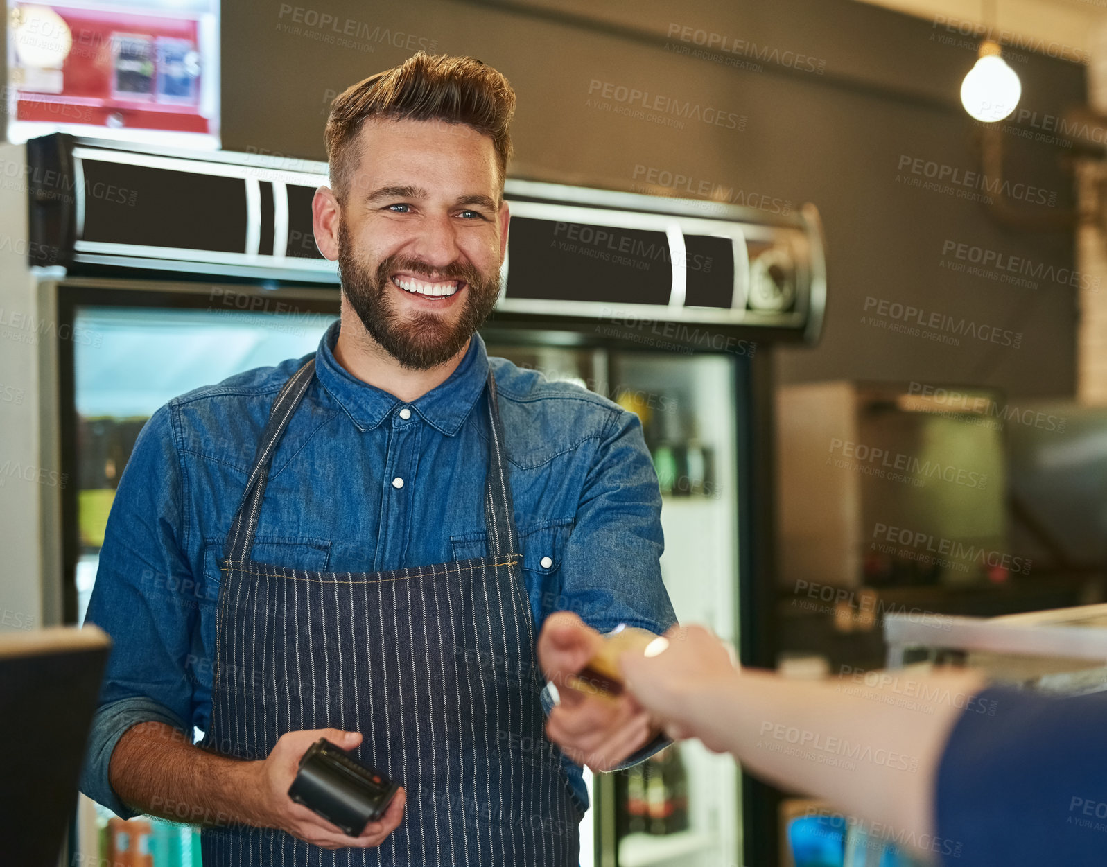 Buy stock photo Credit card, barista or waiter in coffee shop with customer for payment, transaction and purchase at cafe. Restaurant, male employee and person buying for checkout, pos and small business sale