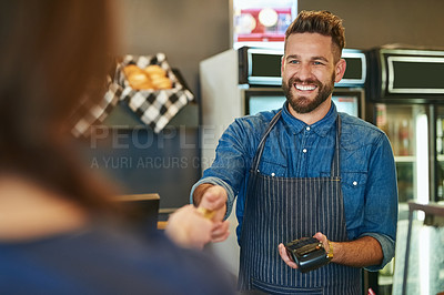 Buy stock photo Cropped shot of a waiter accepting a credit card payment from a customer