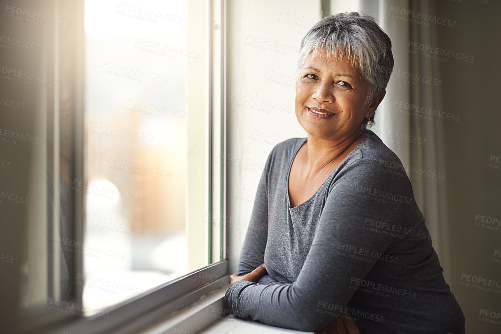 Buy stock photo Window, portrait and senior woman with freedom, relax and cheerful at home, carefree and sunny. Face, mature female person and happy old lady with wellness, retirement and happiness with sunshine