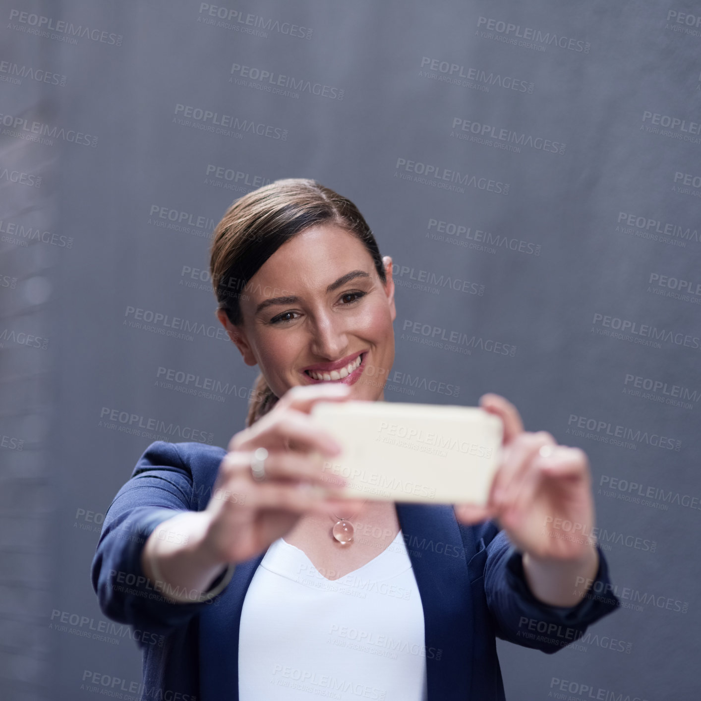 Buy stock photo Selfie, social media and smile with business woman on gray wall background for post or status update. Corporate, phone and profile picture with happy employee in suit for start of professional career