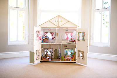 Buy stock photo Shot of a dollhouse in an empty room