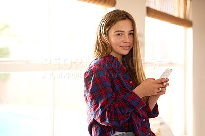 Buy stock photo Home, portrait and little girl with cellphone for social media, texting and online communication. Child, technology and connection for networking, conversation or chatting with smartphone or internet