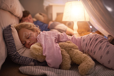 Buy stock photo Cropped shot of siblings sleeping under a blanket fort at home