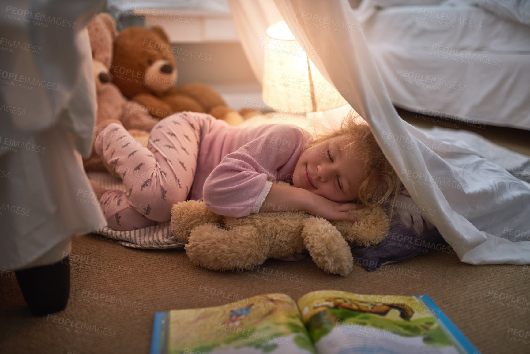 Buy stock photo Cropped shot of a little girl sleeping under a blanket fort at home