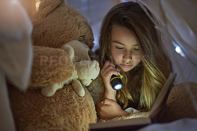 Buy stock photo Flashlight, girl and blanket fort for reading book, learning or education for childhood development. Home, kid or fairytale with storytelling, relax or fantasy for entertainment or knowledge in house