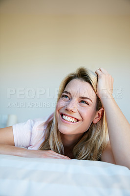 Buy stock photo Shot of a young woman relaxing in her bedroom