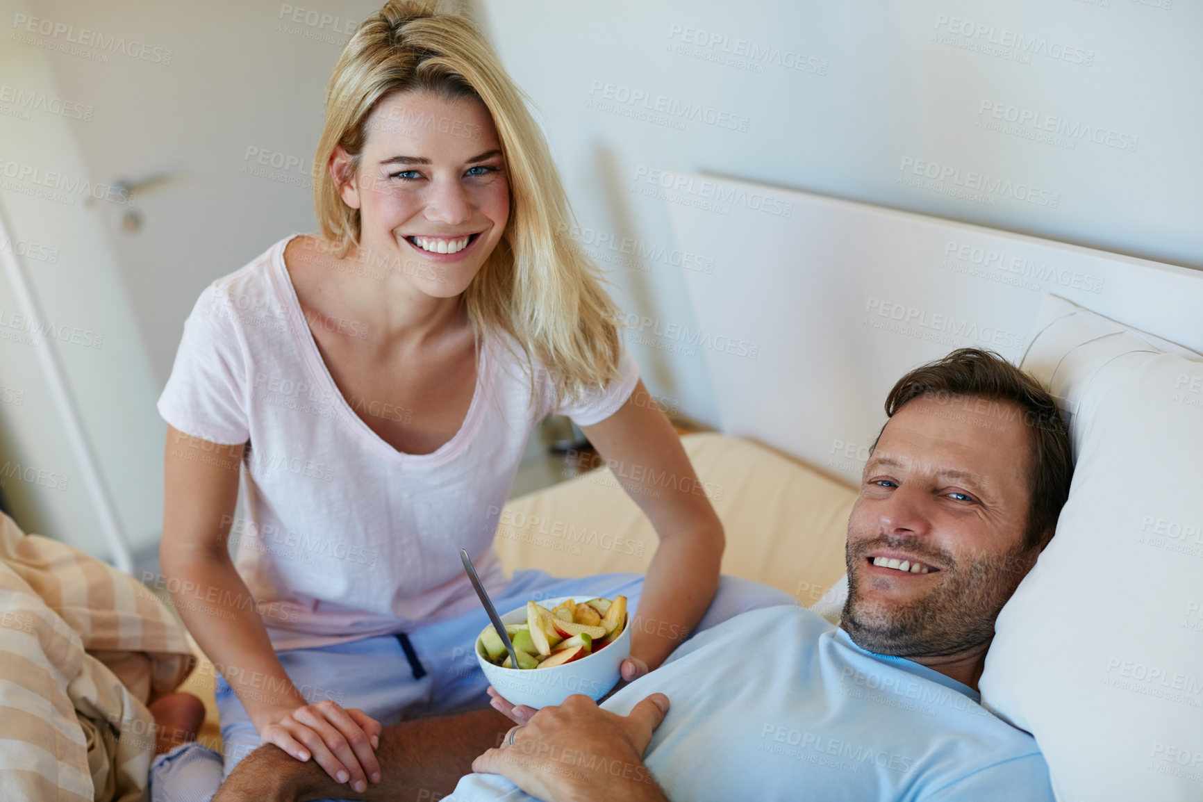 Buy stock photo Shot of a young couple spending time together at home