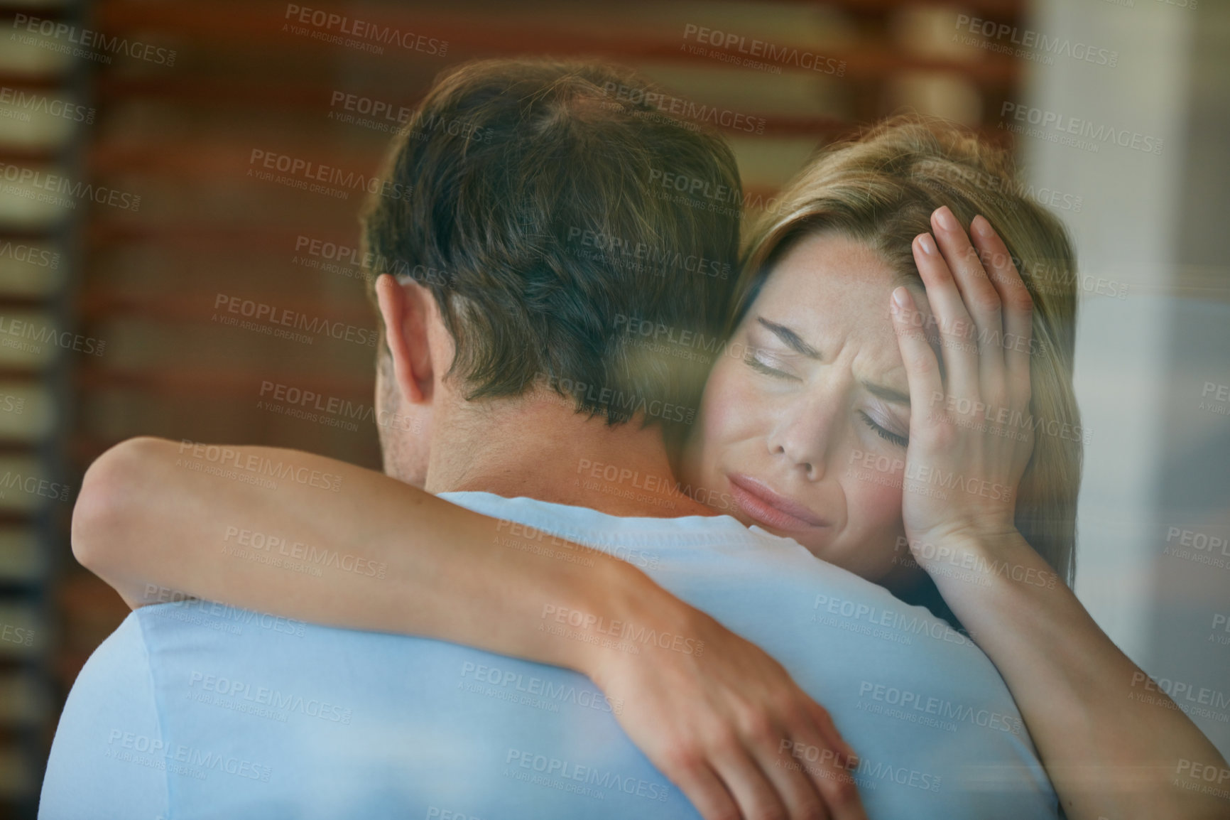 Buy stock photo Shot of a young couple supporting each other through difficulties
