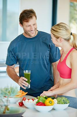 Buy stock photo Cropped shot of a couple preparing a nutritious meal together at home
