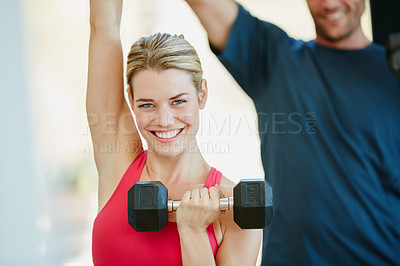 Buy stock photo Portrait of a sporty couple working out together at home