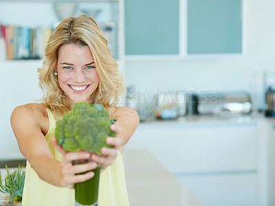 Buy stock photo Portrait of a happy young woman holding a broccoli  shake