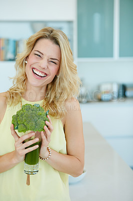Buy stock photo Portrait of a happy young woman holding a broccoli  shake