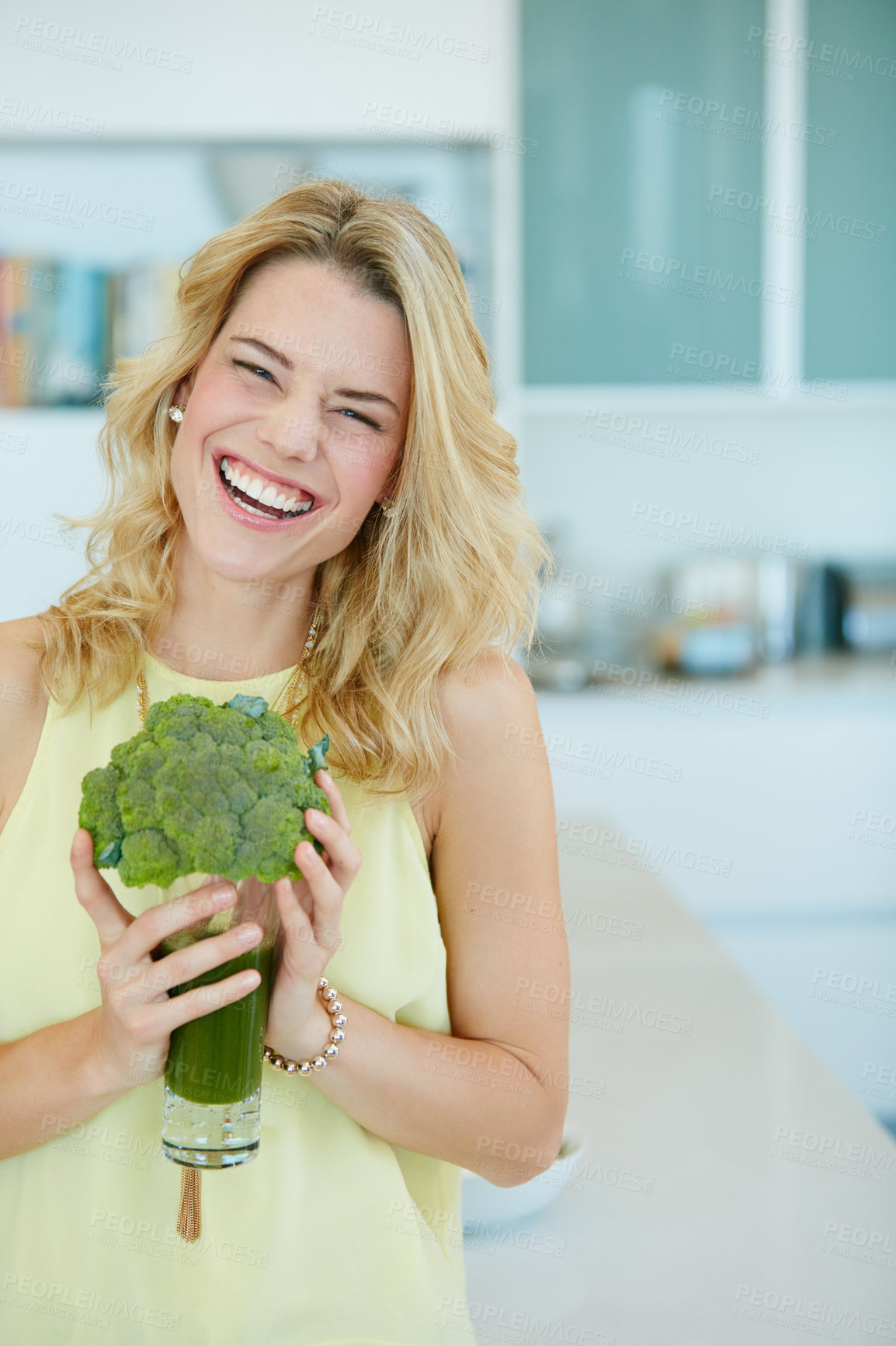 Buy stock photo Portrait of a happy young woman holding a broccoli  shake